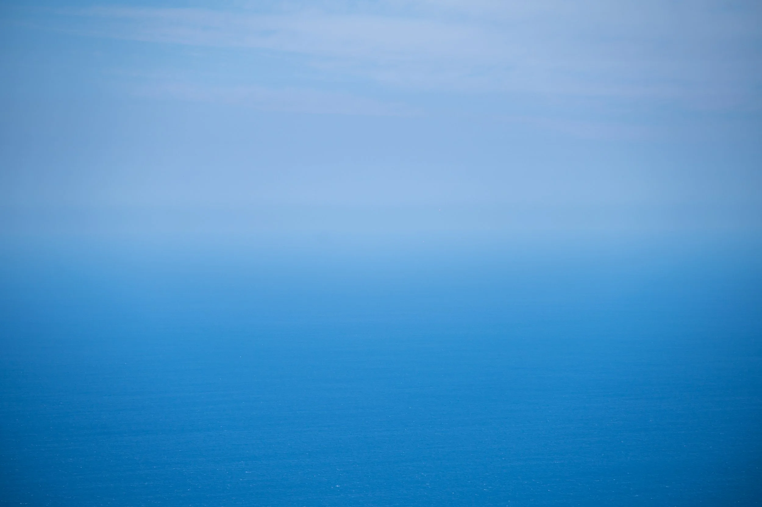 Atlantic Ocean shot, bottom acean and top sky. Foggy day in Blue