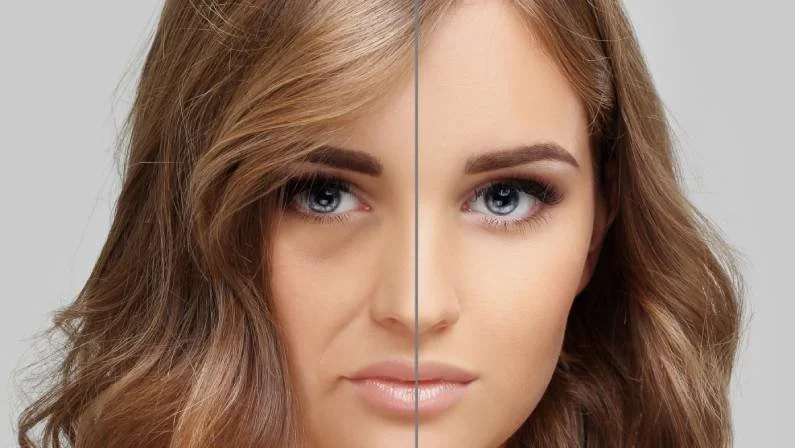 Split image of a woman's face with makeup on the right side and no makeup on the left side.