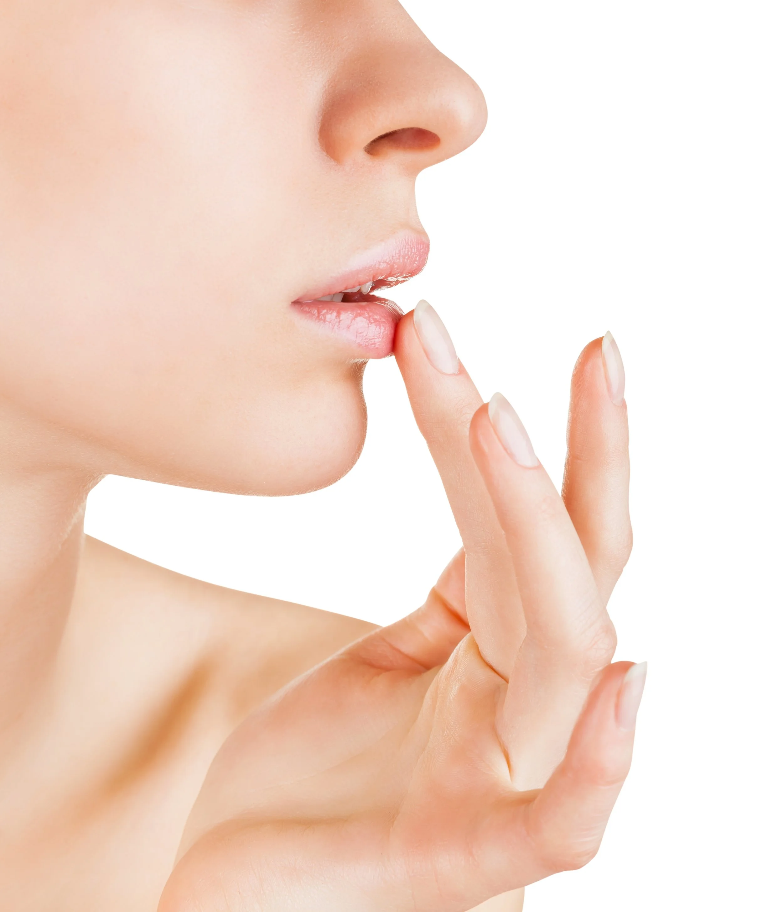 Close-up of a person's face with finger near lips, emphasizing smooth skin and minimal makeup, suggesting a beauty or skincare theme.