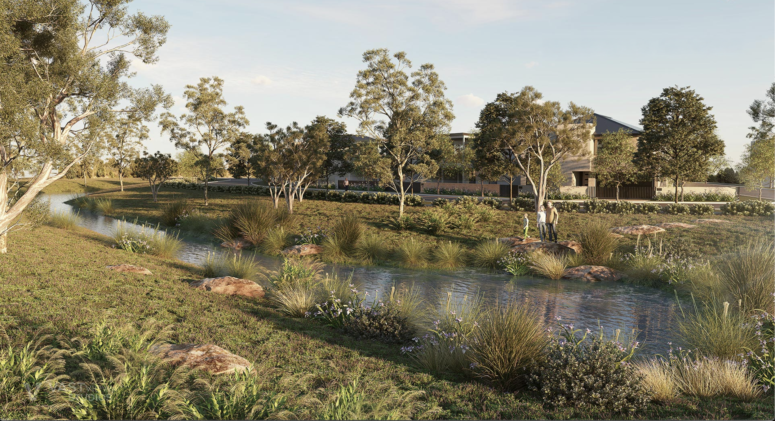 A landscaped park with a small stream, rocks, trees, grass, shrubs, and wildflowers, with a modern building and people walking in the background during daytime.