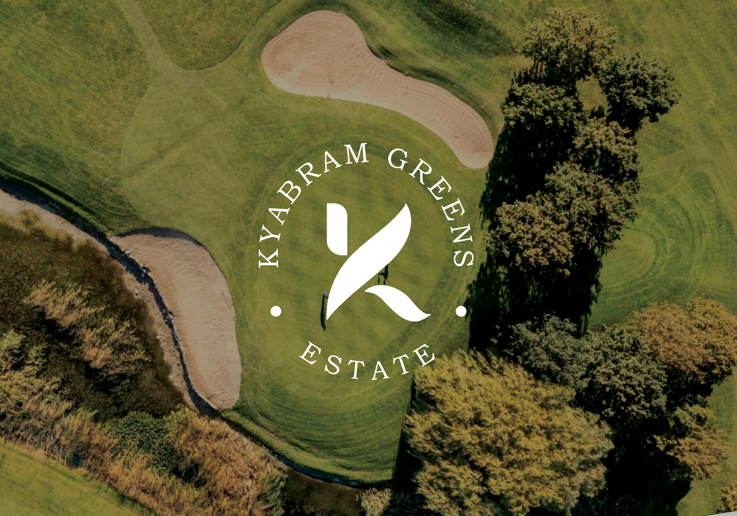 Aerial view of a golf course with a putting green, sand trap, and surrounding trees and grass, overlaid with a logo that reads 'KAYABRAHM GREEN ESTATE' with a stylized white leaf in the center.
