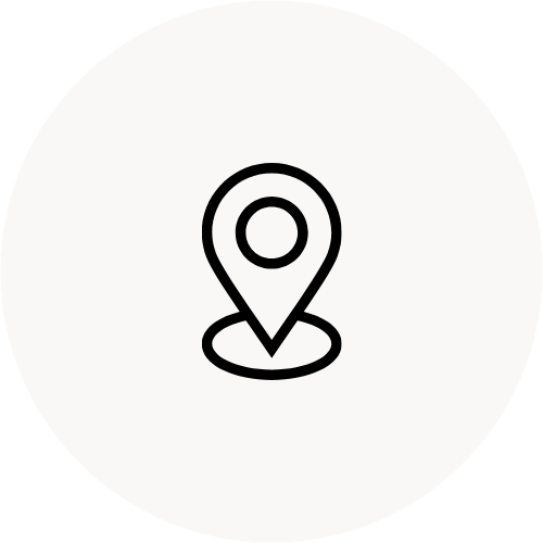 Map pin location icon on a gray background.