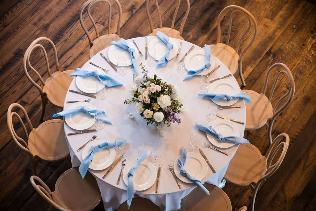 The formula for a beautiful tablescape:

Linens + florals + candles + place settings + texture.