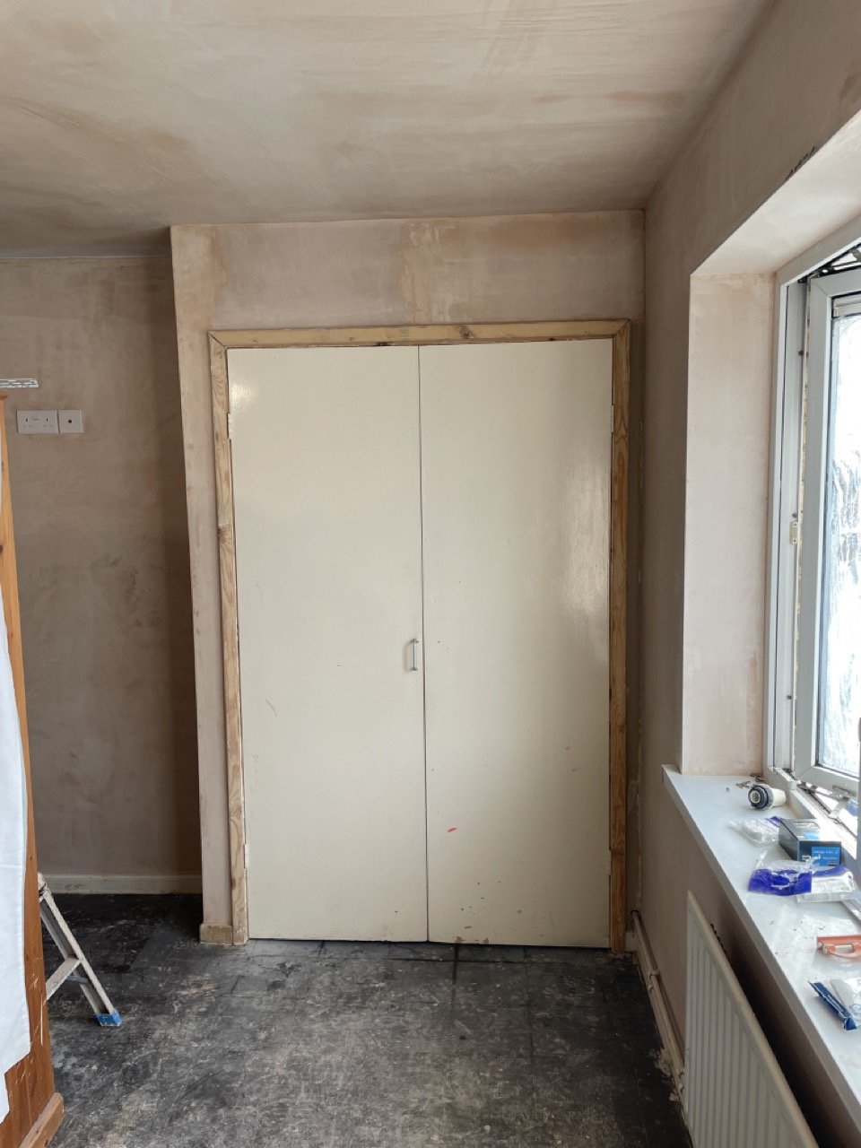 Residents interior bedroom during preparation (plastering completed) before painting and decorating.