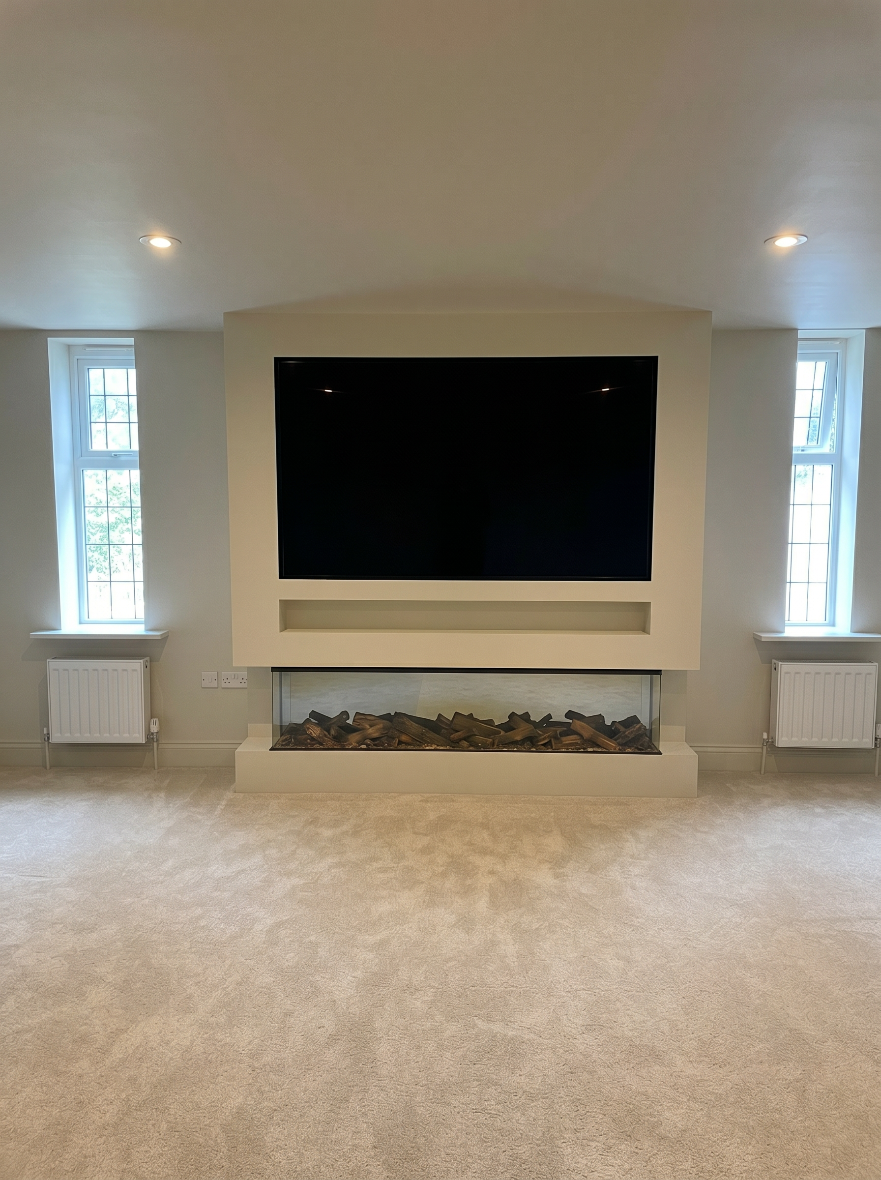 Completed residential interior with freshly painted tv console and walls to a clean high quality finish.
