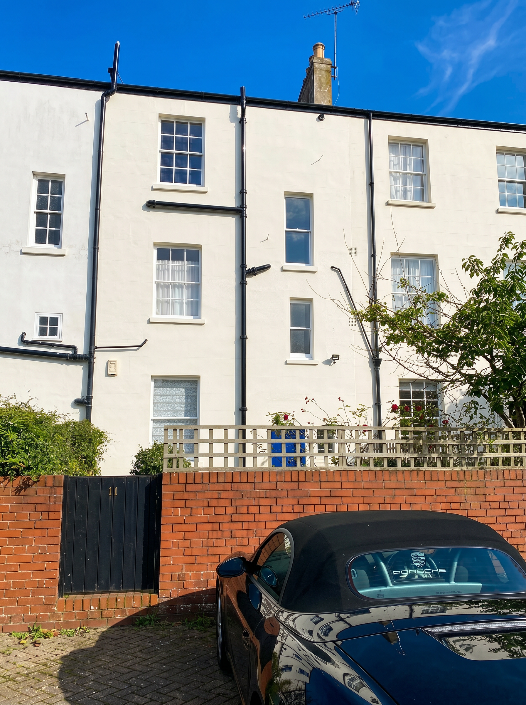 Town house exterior after professional painting and restoration.