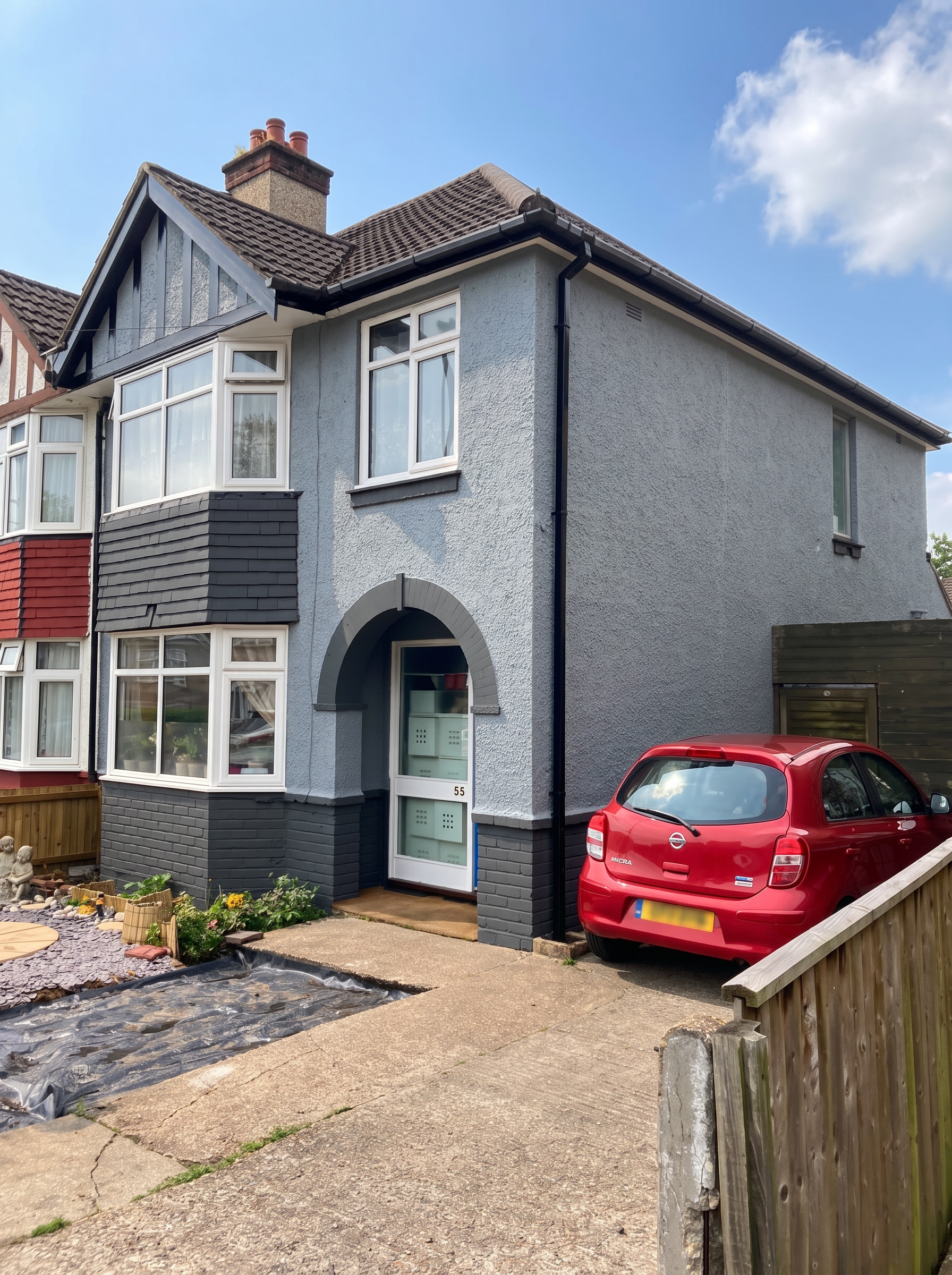 Completed house exterior after professional painting and decorating.