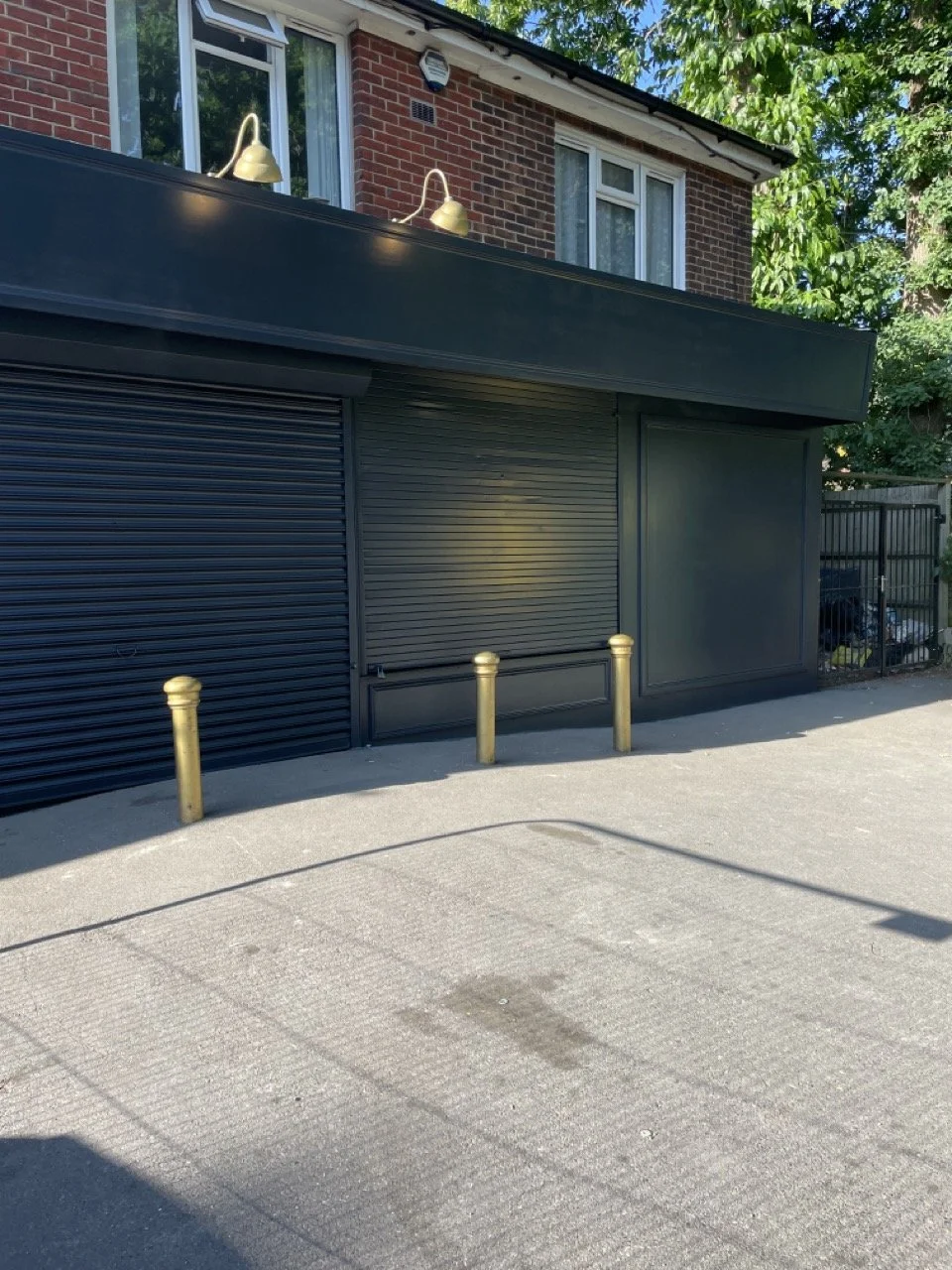 Completed commercial exterior surface decoration, utilising specialist spray application for a seamless matte black finish.