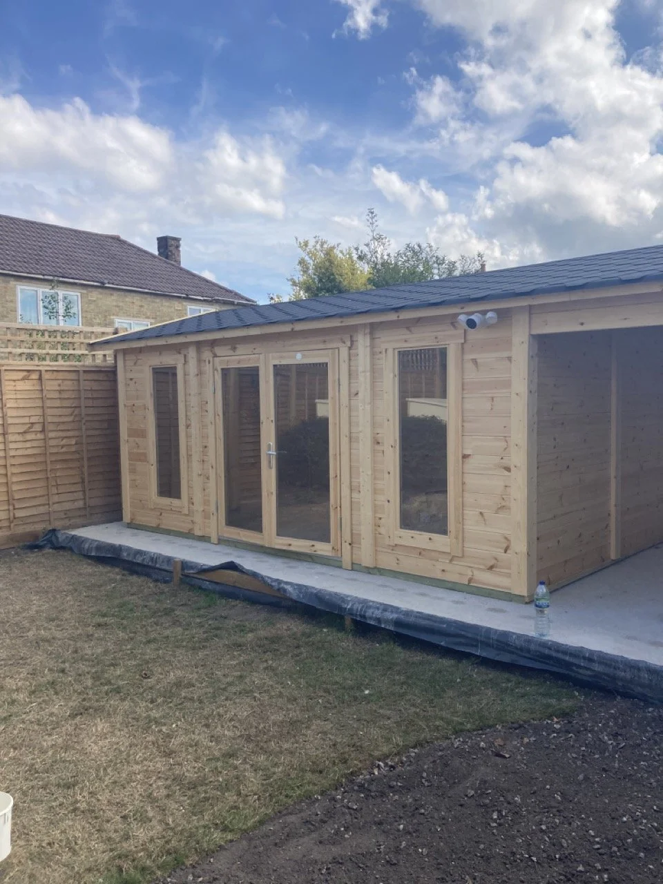 Garden outhouse prepared for exterior wood finishing and decoration.
