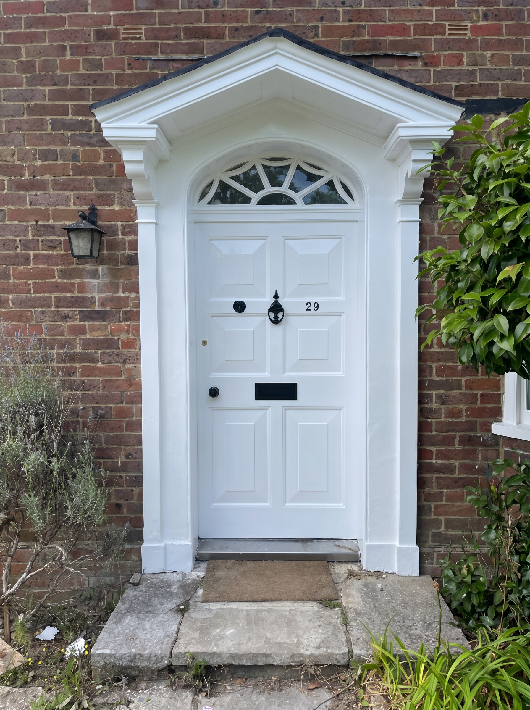 Restored front door and exterior woodwork with high-quality painted finish.