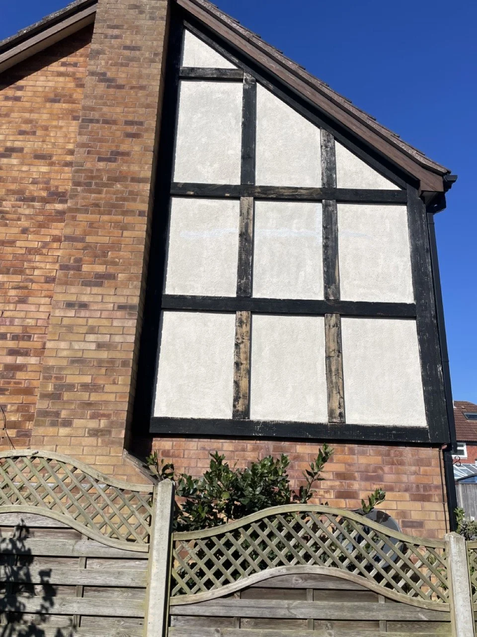 Exterior residential wall preparation before professional painting and decorating.
