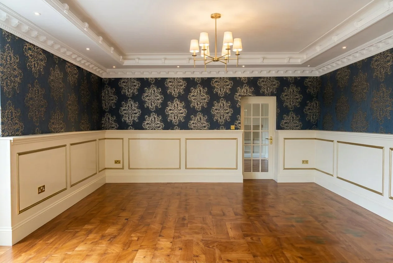 Finished living room with restored fireplace and freshly decorated walls.
