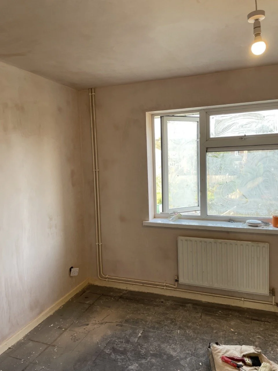 Residents interior bedroom walls after preparation and plastering work.