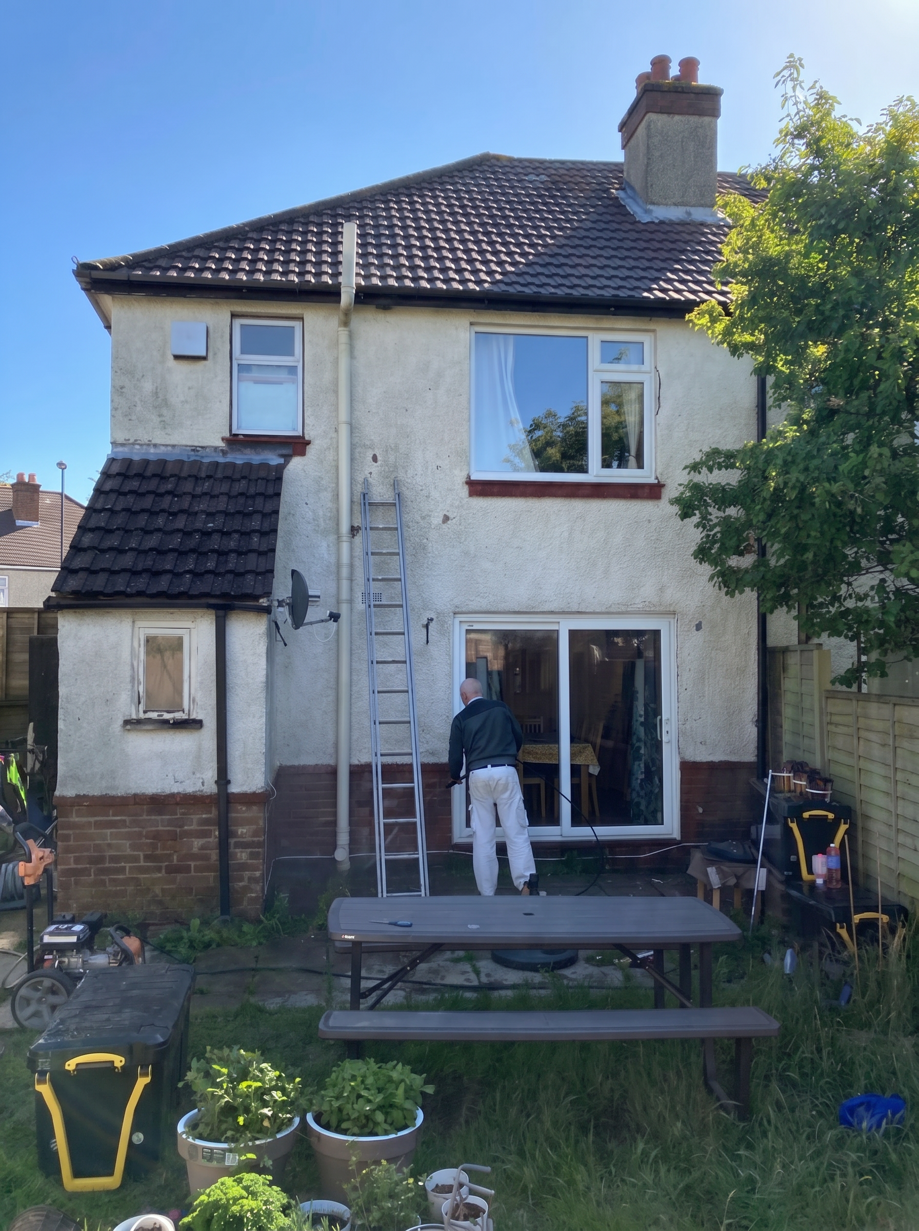 Garden-facing exterior before painting and decorating work.