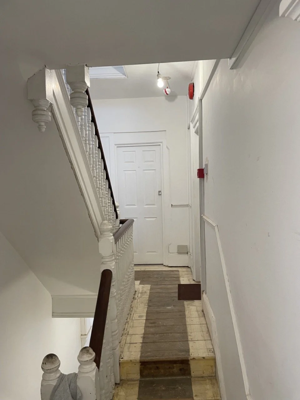 Hallway and staircase during preparation for decorating.