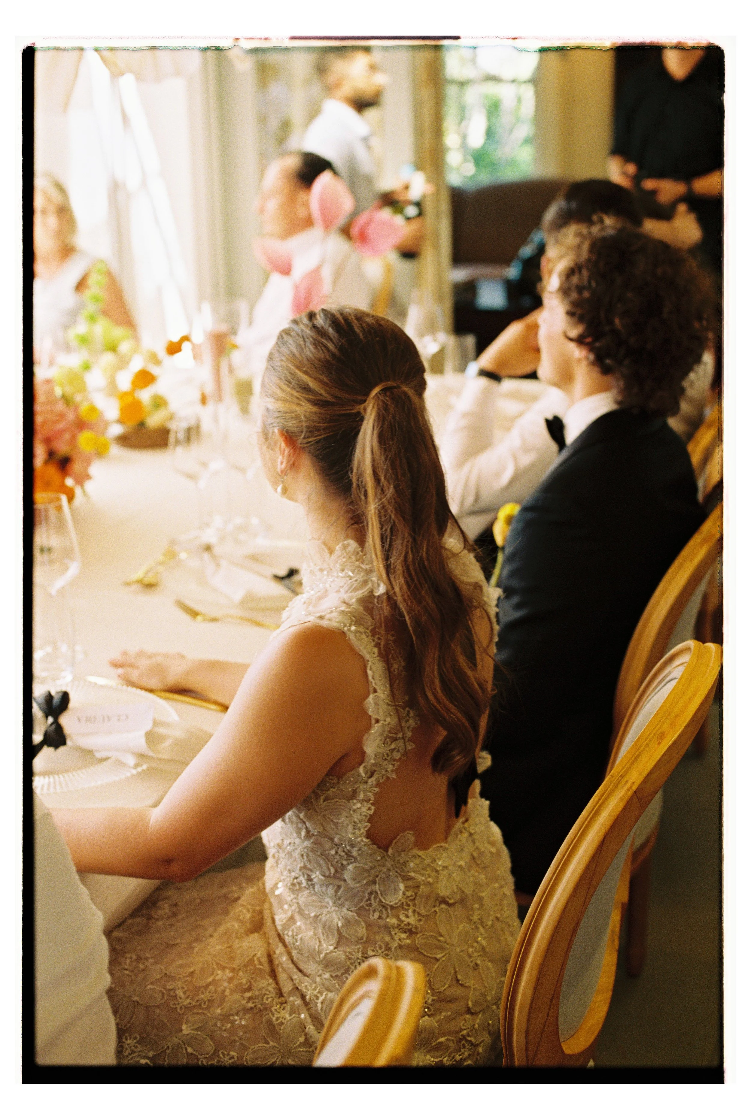 Bride and Groom attentively listening to speeches at their lunch reception at home in Tamboerskloof Cape Town