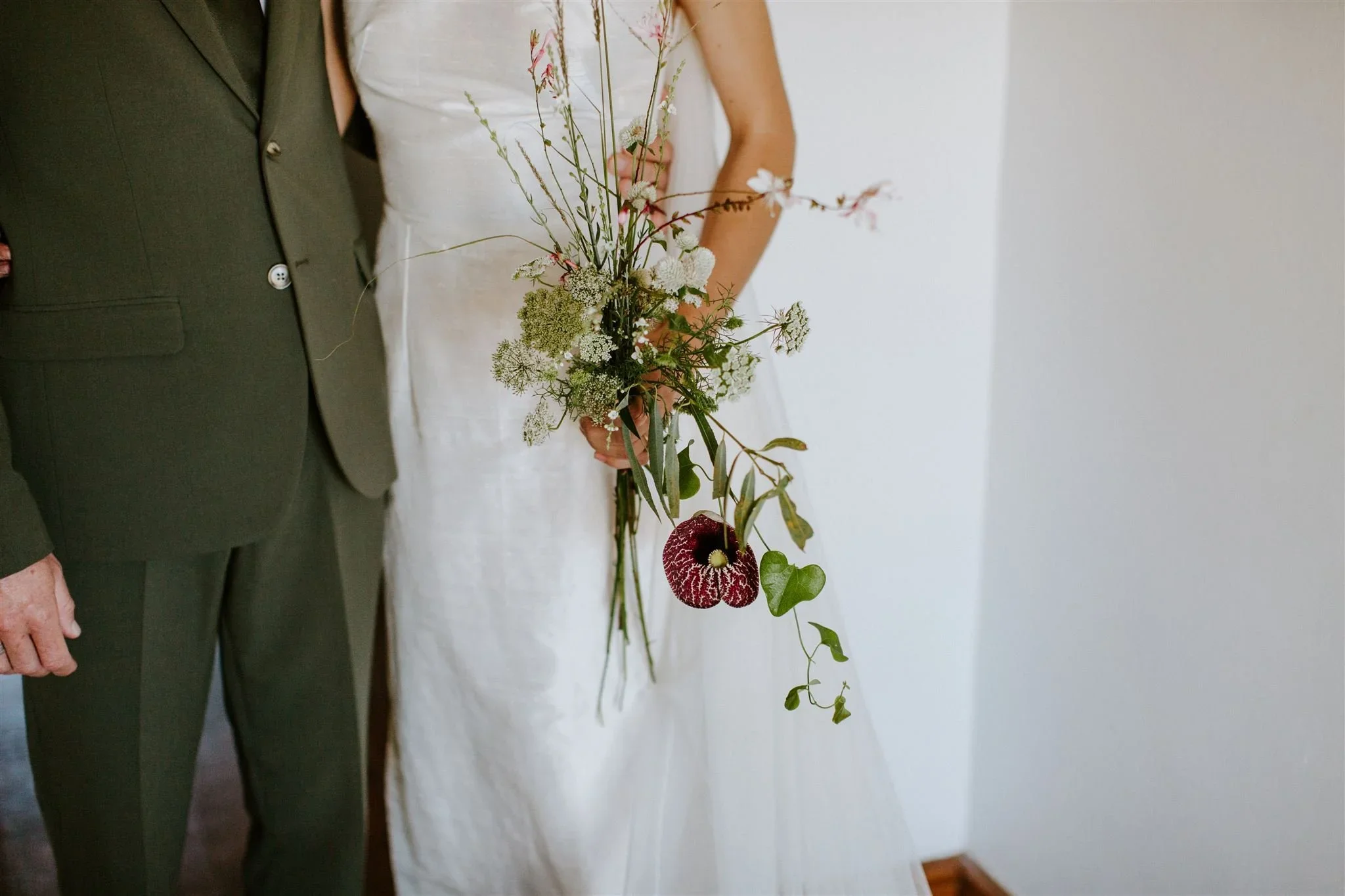 Bridal bouquet made from flowers the bride foraged the day before her wedding in the gardens of Stanford
