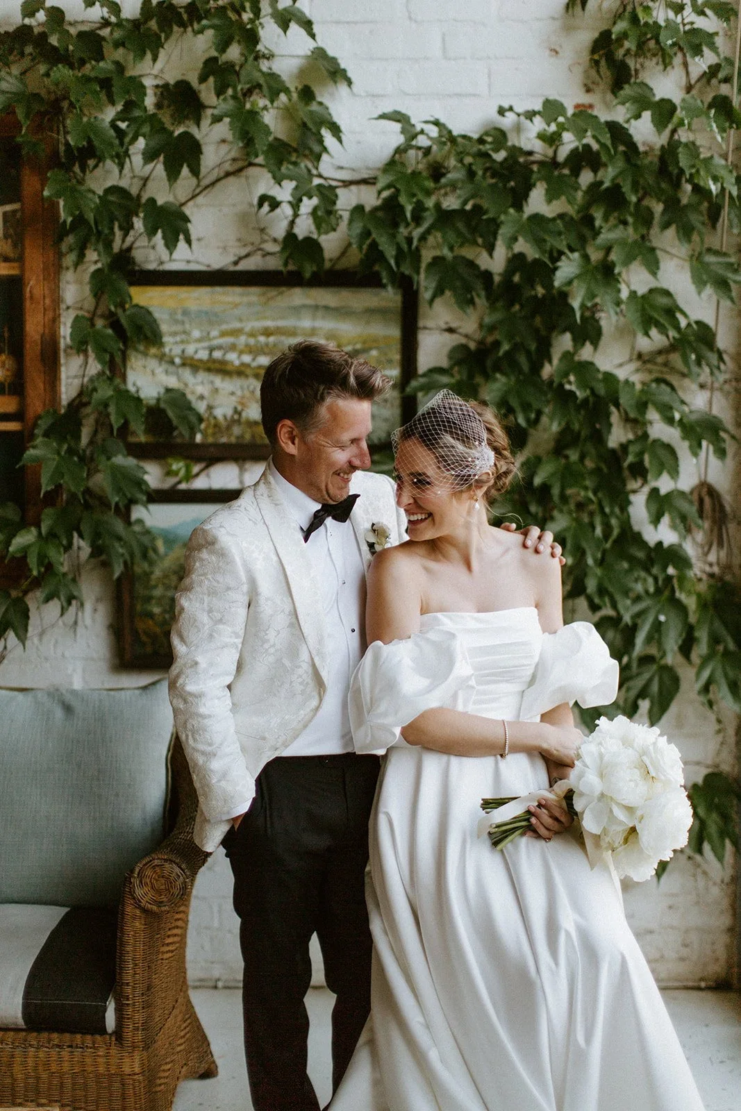Bride and groom sharing a laugh as they look at each other during a portrait session at Johannesdal 1207.