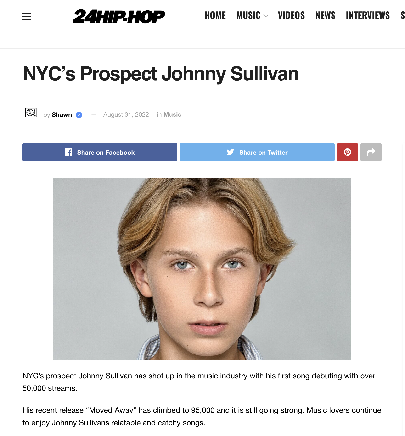 Review of Johny Sullivan's music Close-up portrait of Johnny Sullivan with blond hair and blue eyes looking at the camera, against a plain gray background.