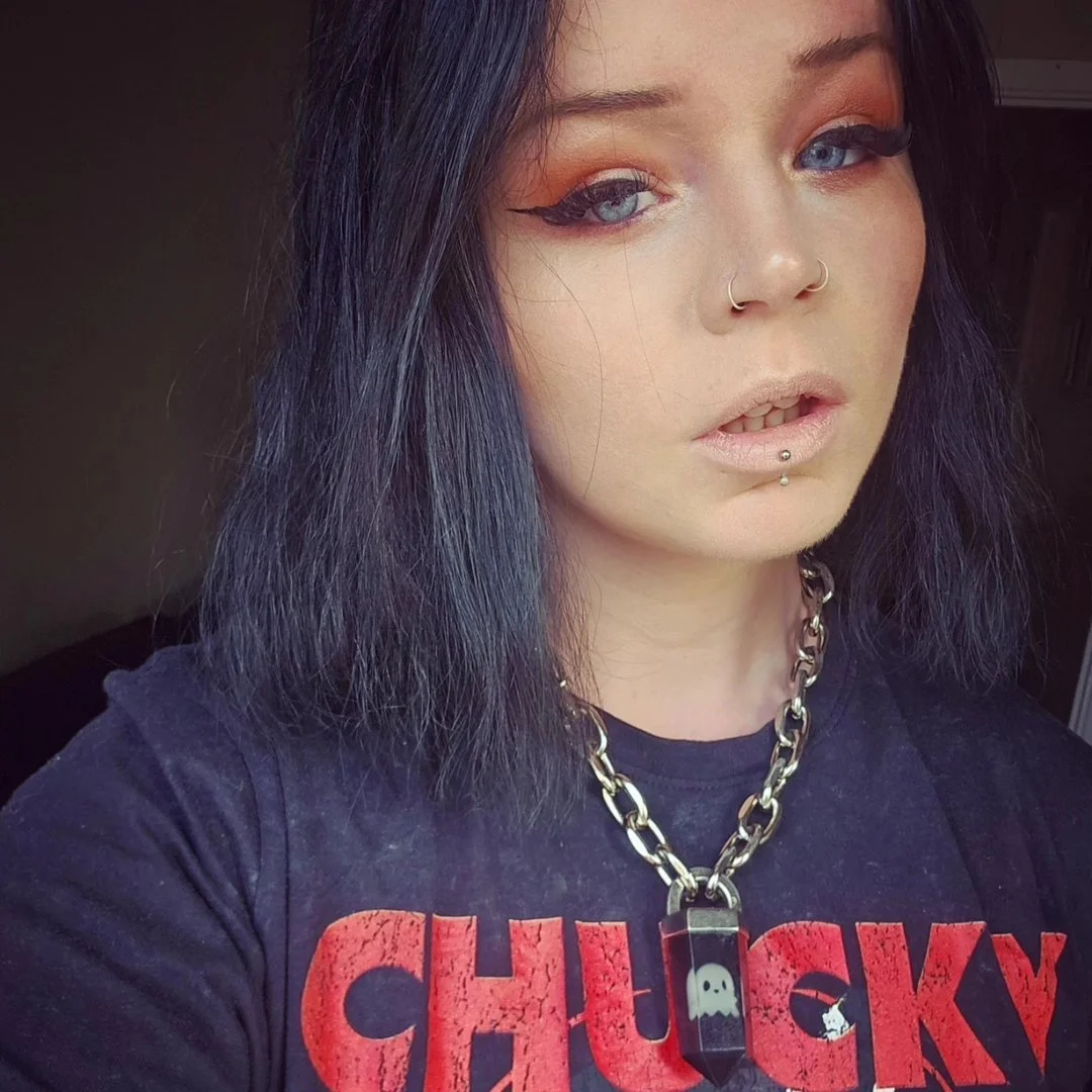 Girl with eye make up and a necklace