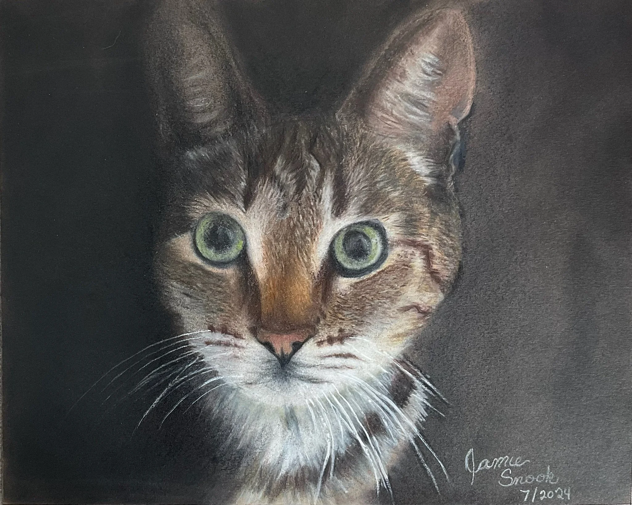 Close-up of a detailed painting of a kitten with green eyes, light fur, and dark markings on a dark background, with a personalized message and date at the bottom right corner.