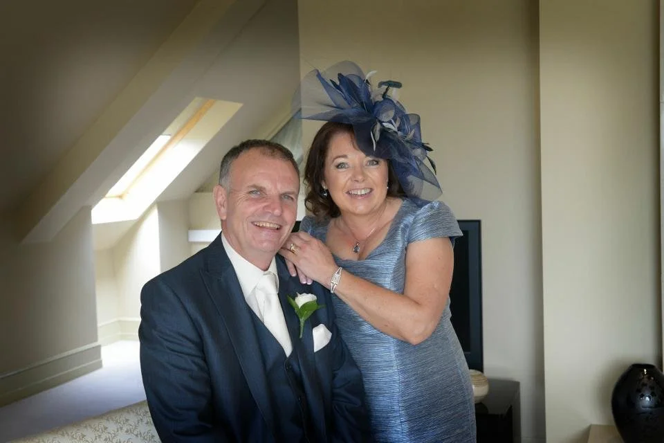 Wedding ready wearing a John Paul Millinery headpiece