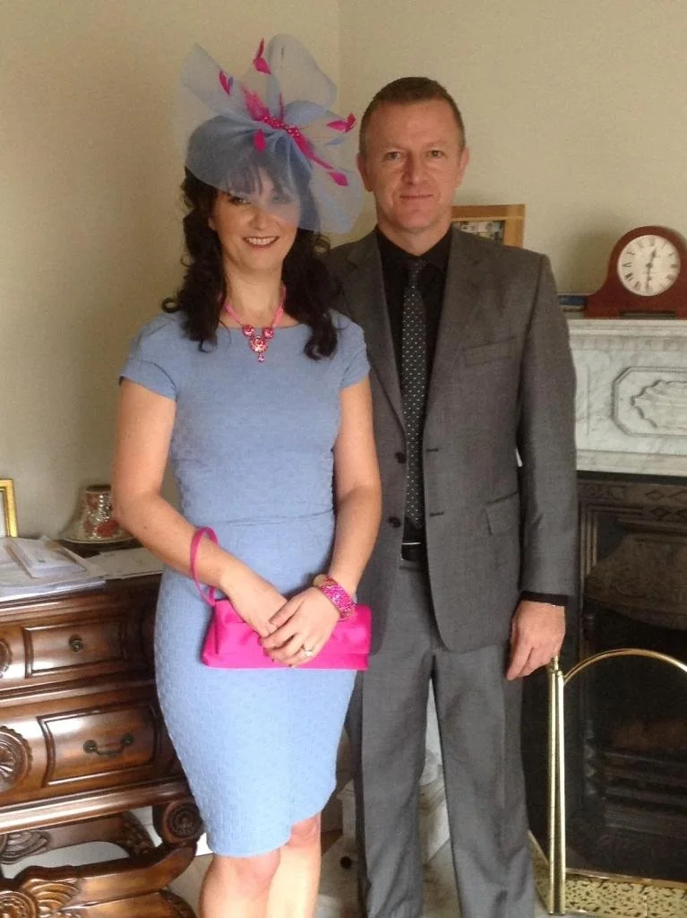 Wedding guest wearing a John Paul Millinery headpiece