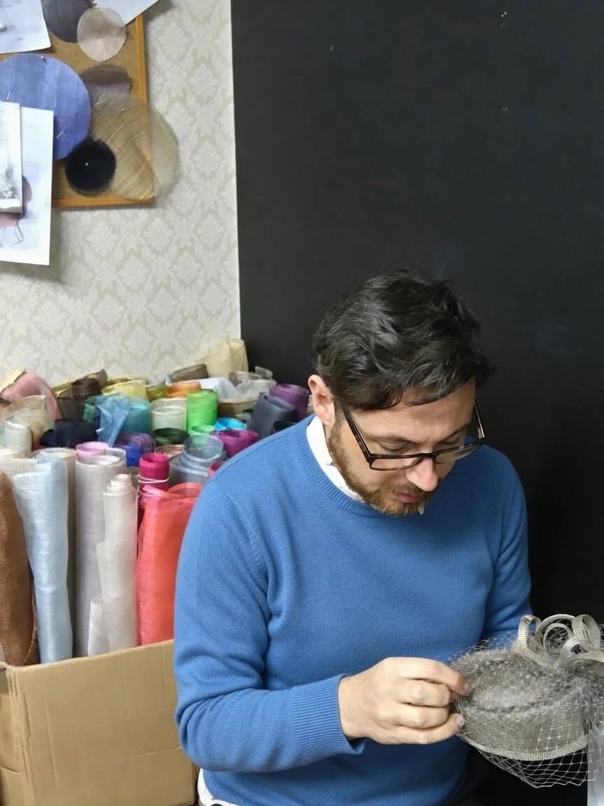 John Paul had sewing one of his hats in his studio