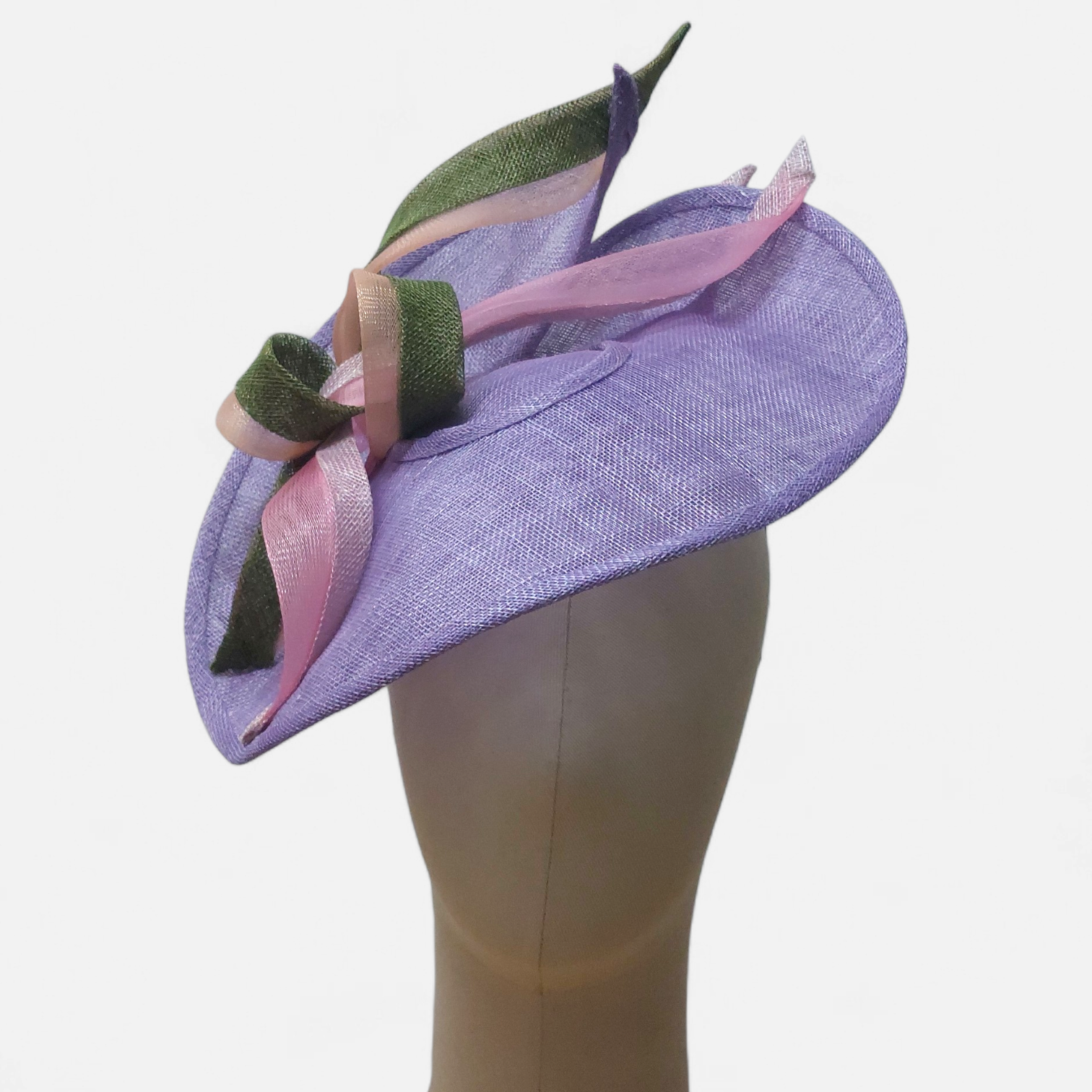 Lavender-colored women's hat with pink and green ribbon accents on a mannequin head.