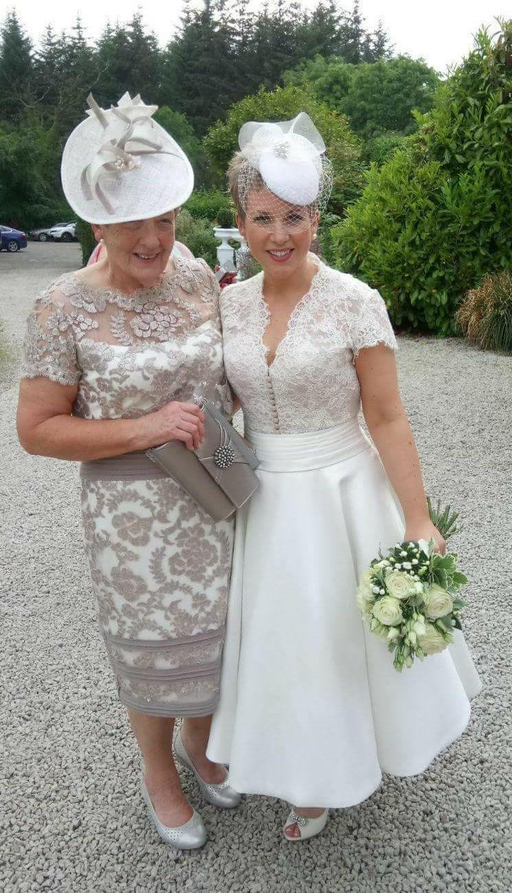 Bride and Mother of the Bride both wearing John Paul Millinery