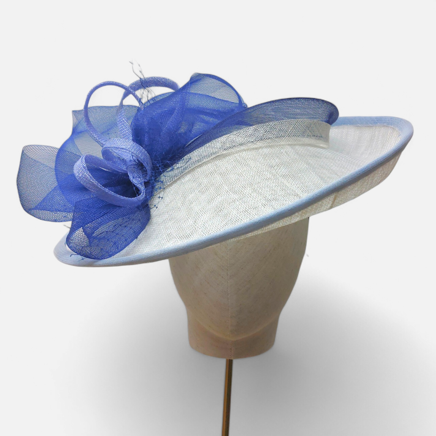 White hat with blue crinoline and feather decoration by John Paul Milinery