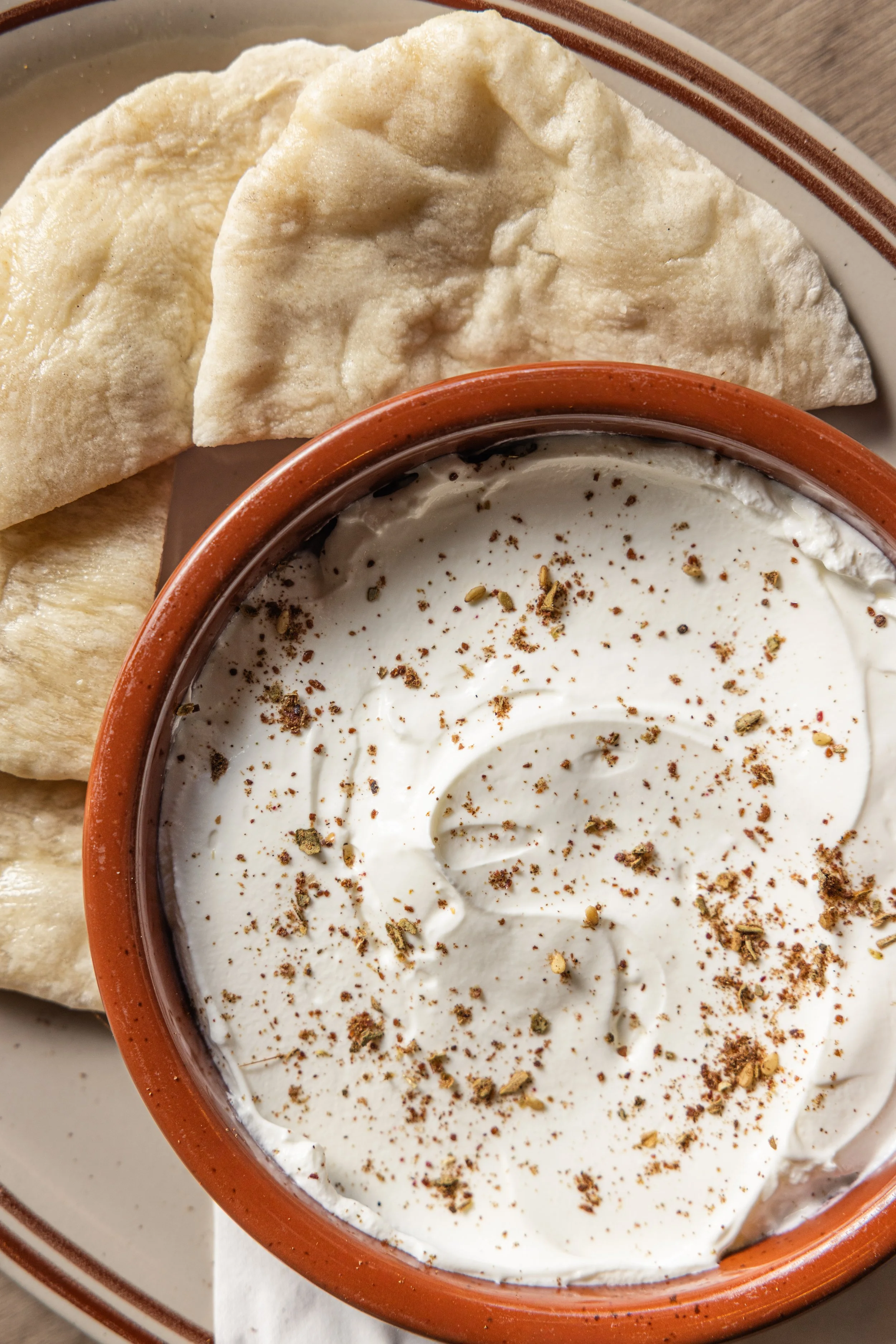 LABNEH
Labneh, olive oil, za’atar, warm flatbread (v) · Lebanon