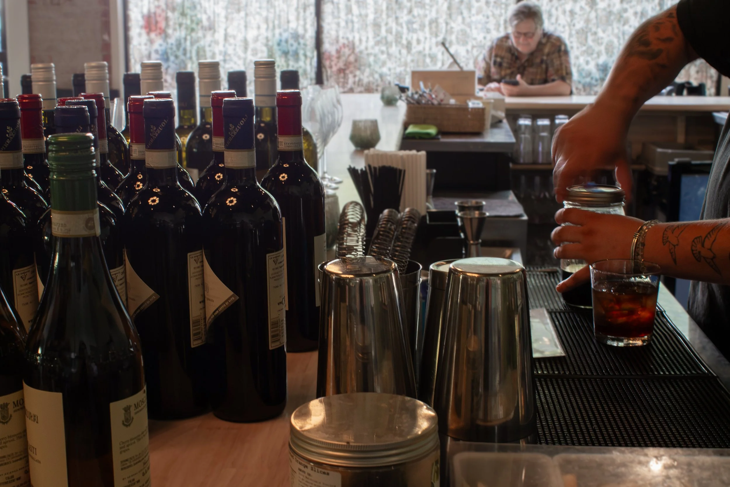 Close up of cocktails being prepared at the bar.