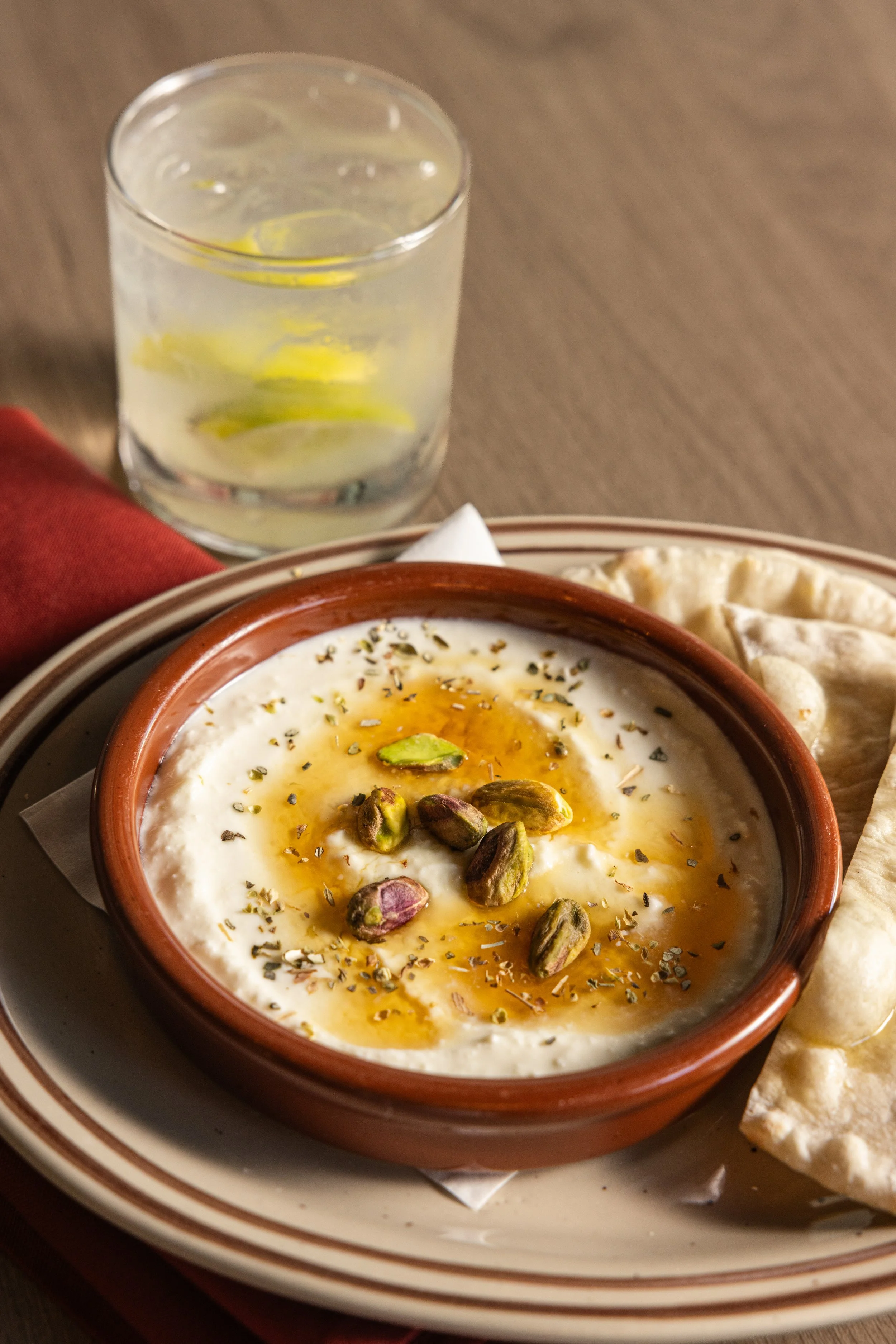 WHIPPED FETA
Whipped feta, thyme-chile honey, pistachios, warm flatbread (v, tree nuts) · Greece