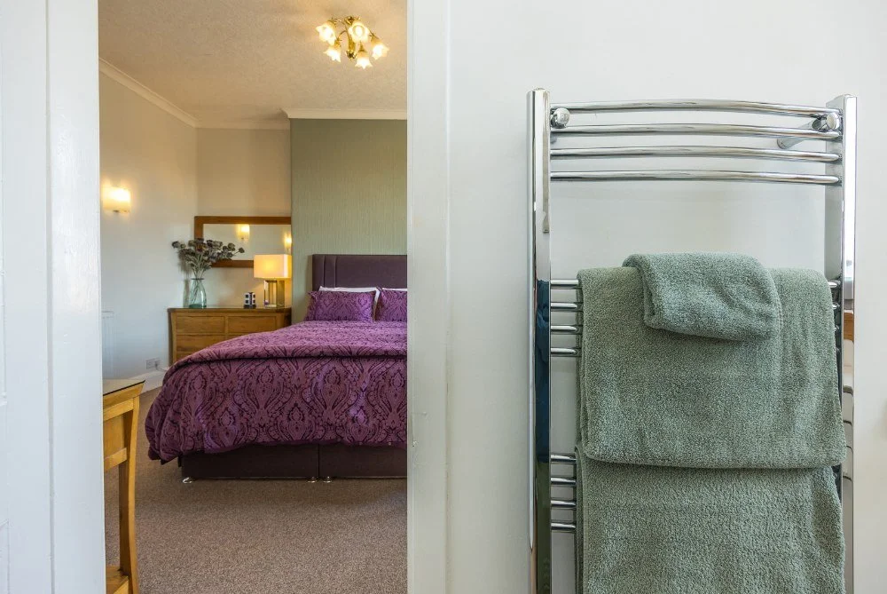 double-bedroom-ensuite-towel-view-pinewood-country-house.jpg