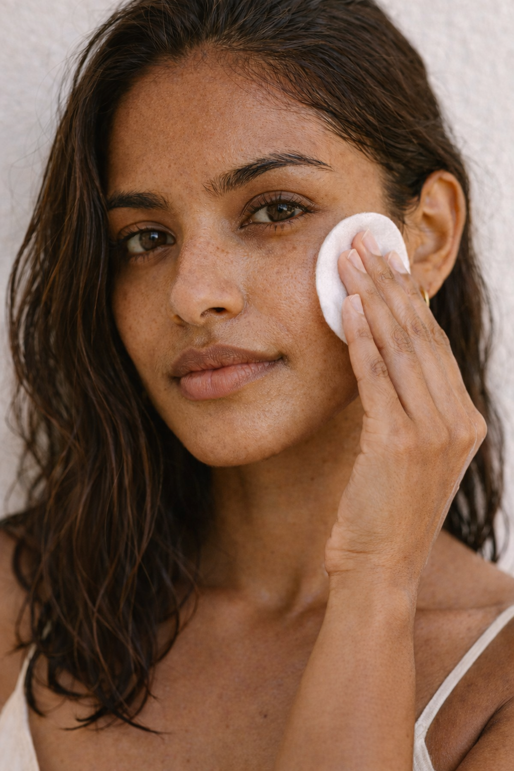 indian female model cleansing pad.png