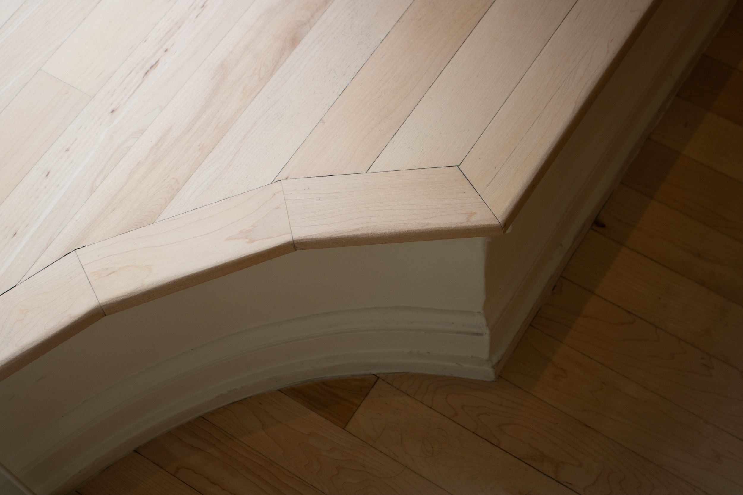 Detail shot of the window display's wood-clad floor.