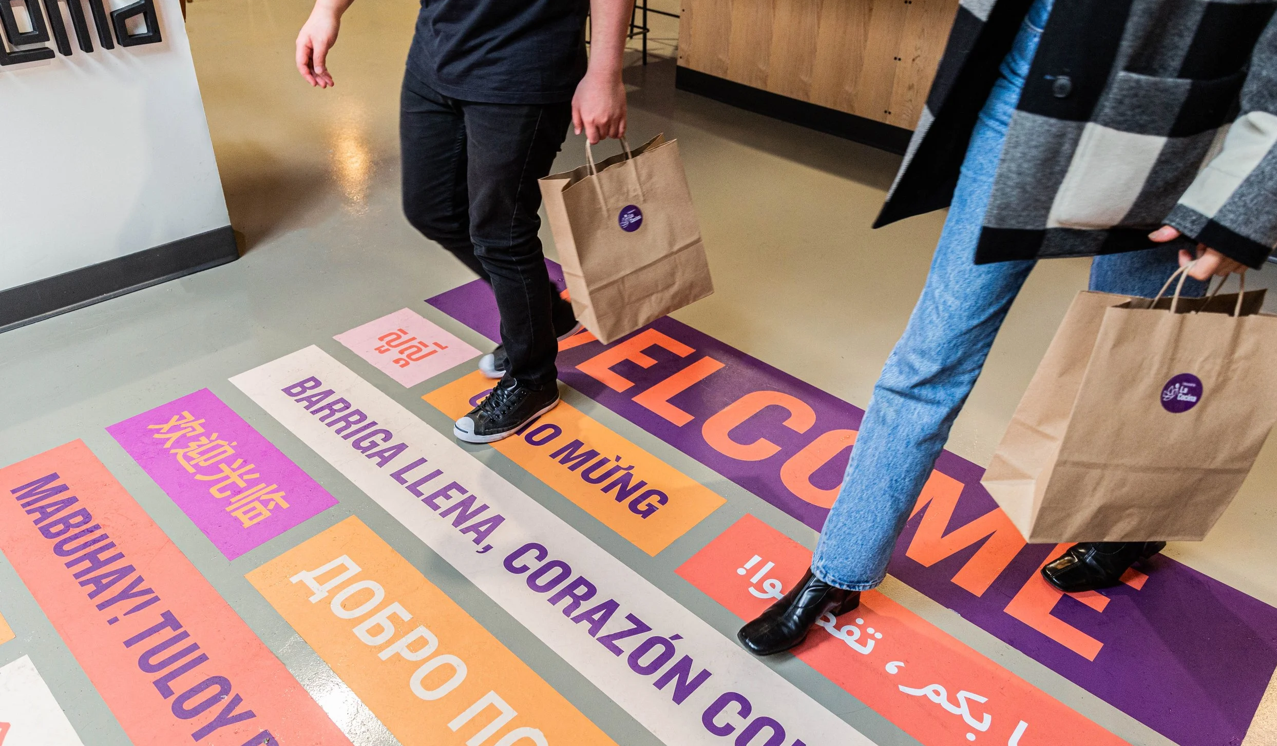 The Market Hall's expereince starts the moment you step inside, with custom floor graphics greeting you in range of languages.