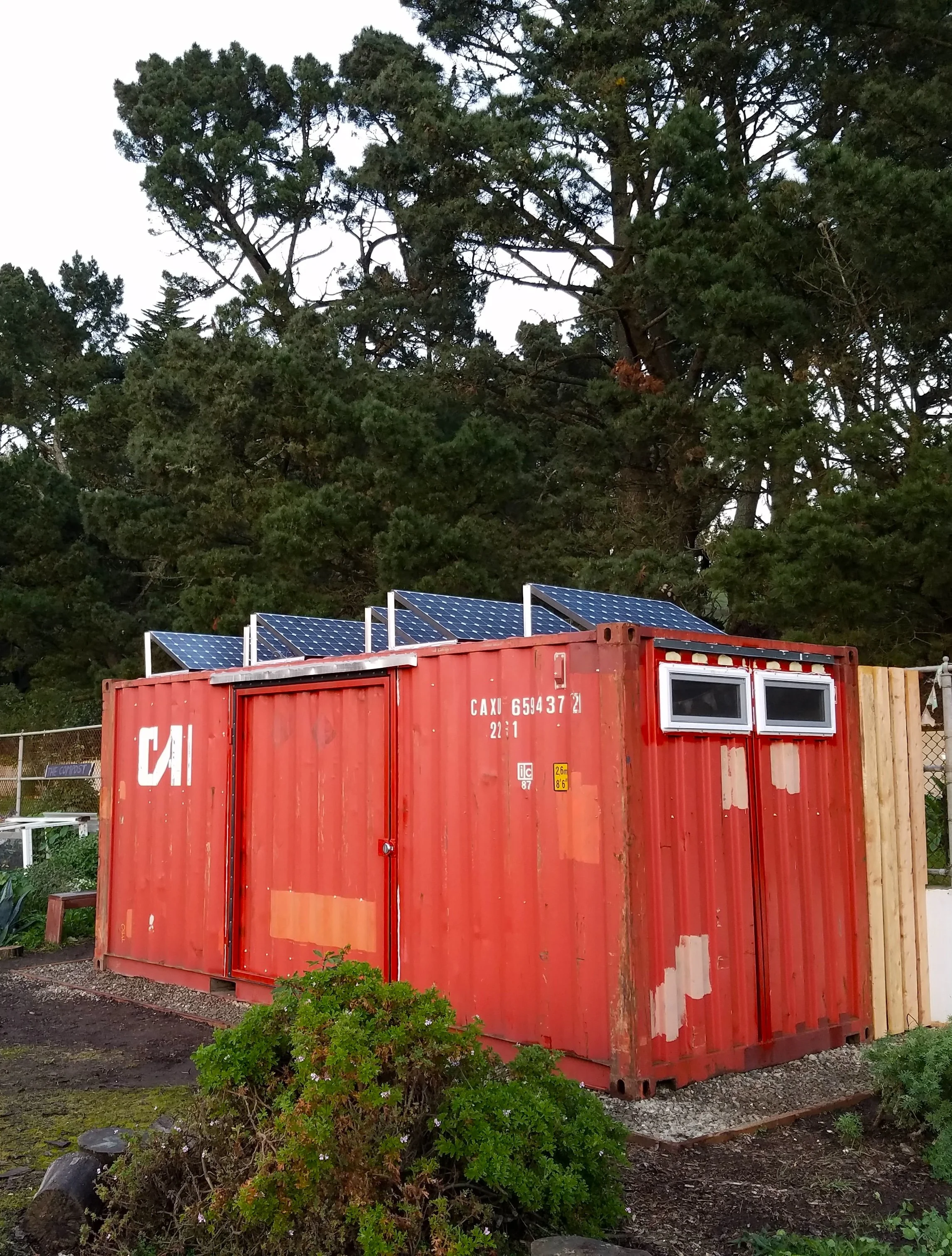 The red shipping container can close its doors, warding off mice, pests or any water damage.