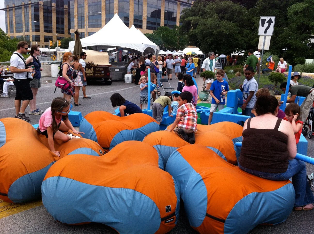 Bubbleware offers a playful, lightweight seating solution as children and adults alike play on the abstract, orange and blue inflated seating solutions.