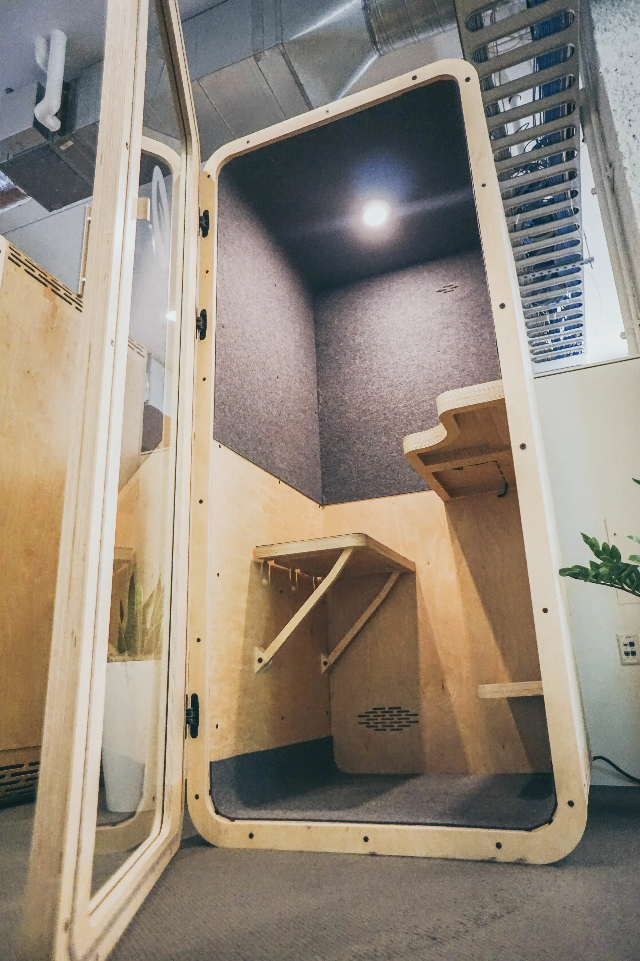 Inside the Jumpbooth, an adjustable bench and small desk.