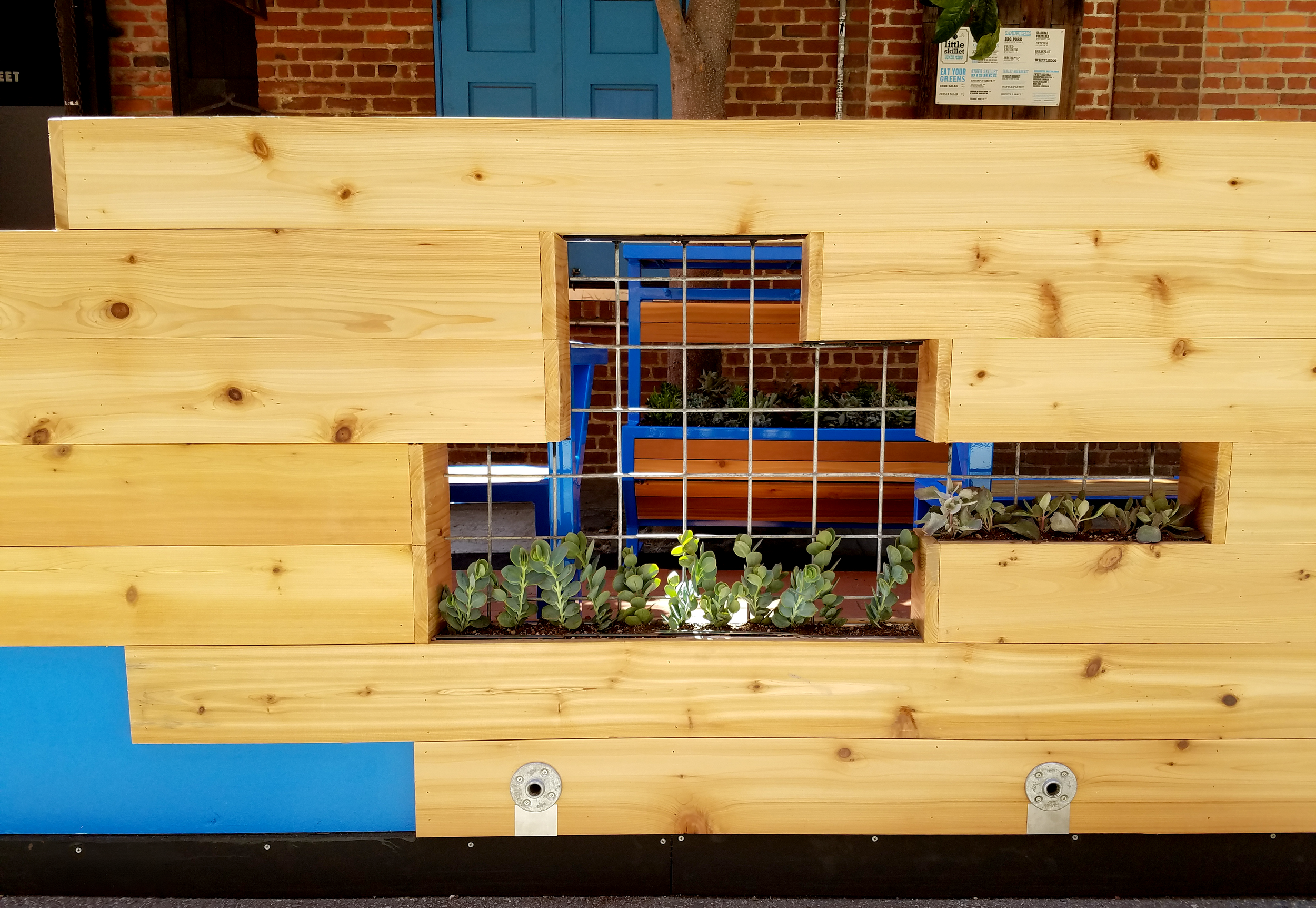 Detail shot of a planter, embedded in the cedar parkelt wall.