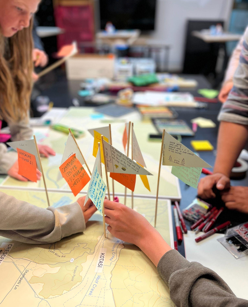 Participants place flags on a map, tracking some of their favorite memories before the Dixie Wildfire.