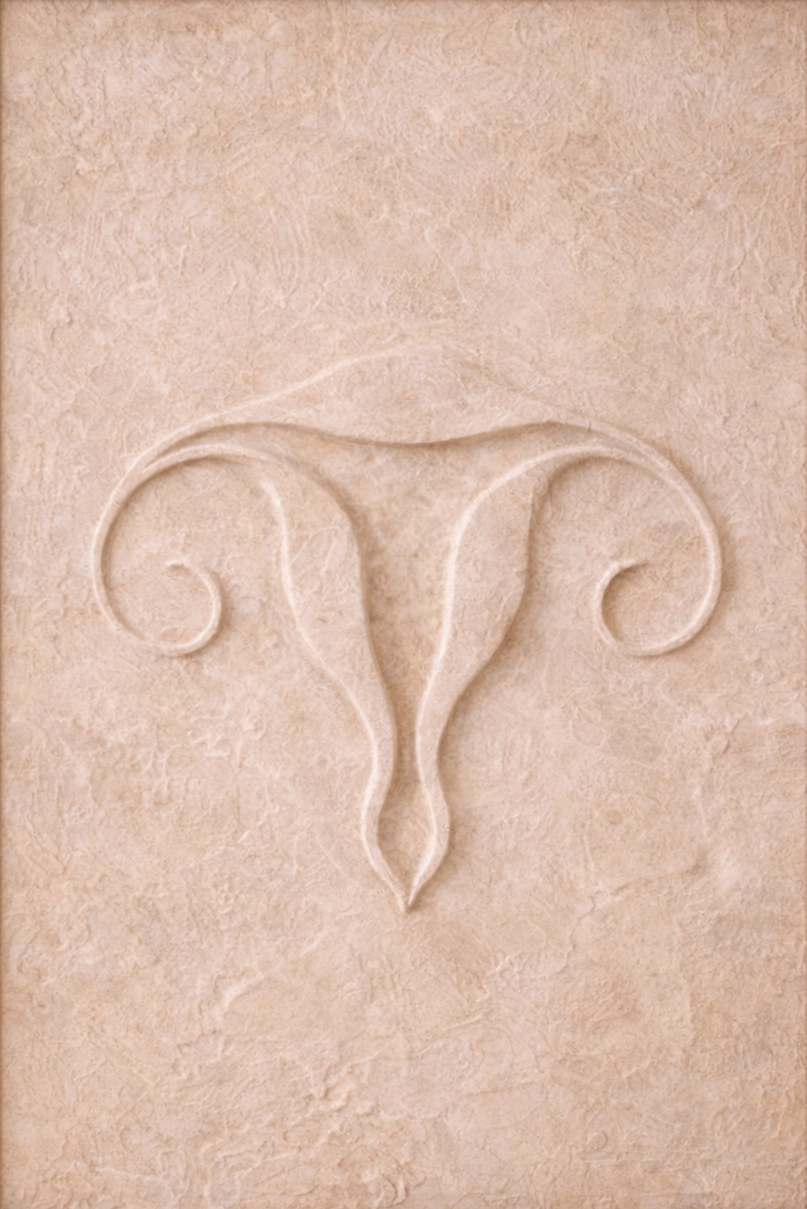 Close-up of an embossed design resembling a stylized, ornamental shape or symbol on a beige or light peach textured surface.