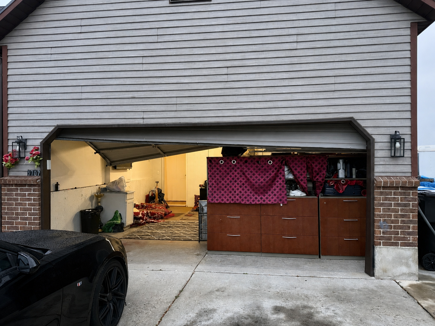 Off-track garage door stuck open before repair