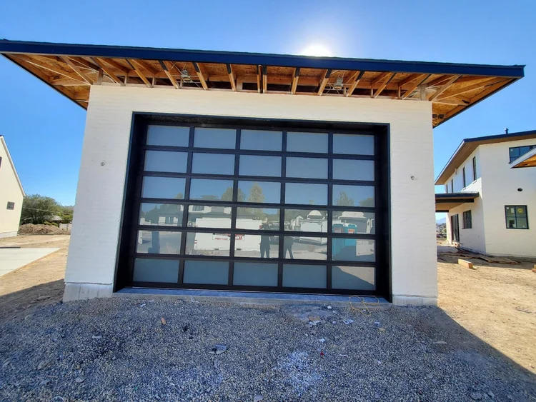 Modern glass-panel garage door from Beehive State Doors’ installation gallery