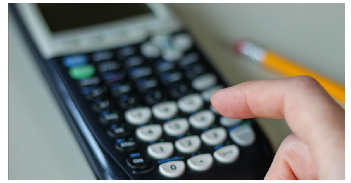 Image of a hand using a TI Calculator