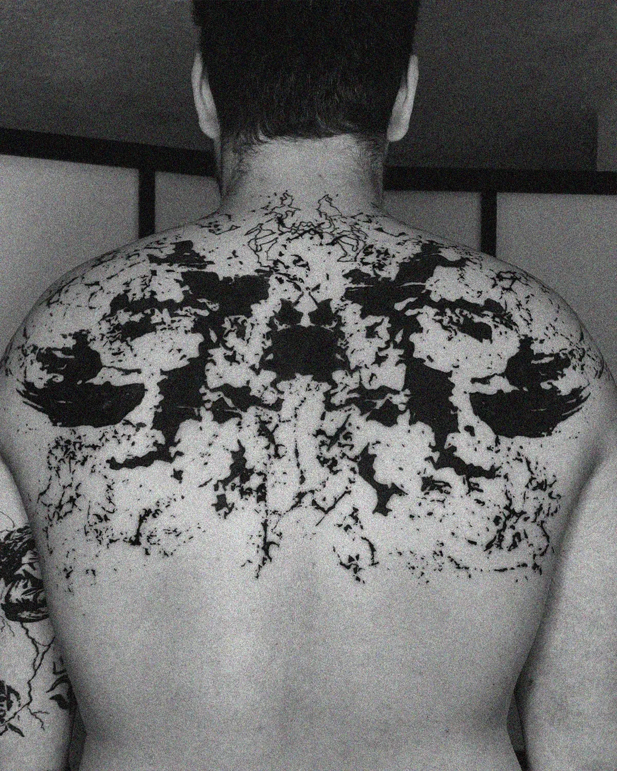 Symmetrical abstract blackwork on upper back. Rorschach inspired ink art by ghost.of.catharsis.