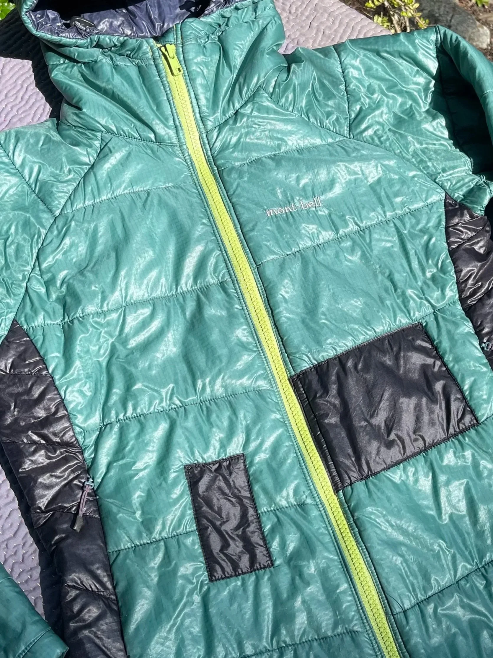 ancient montbell puffer get a full heavy-duty zipper replacement and patches.