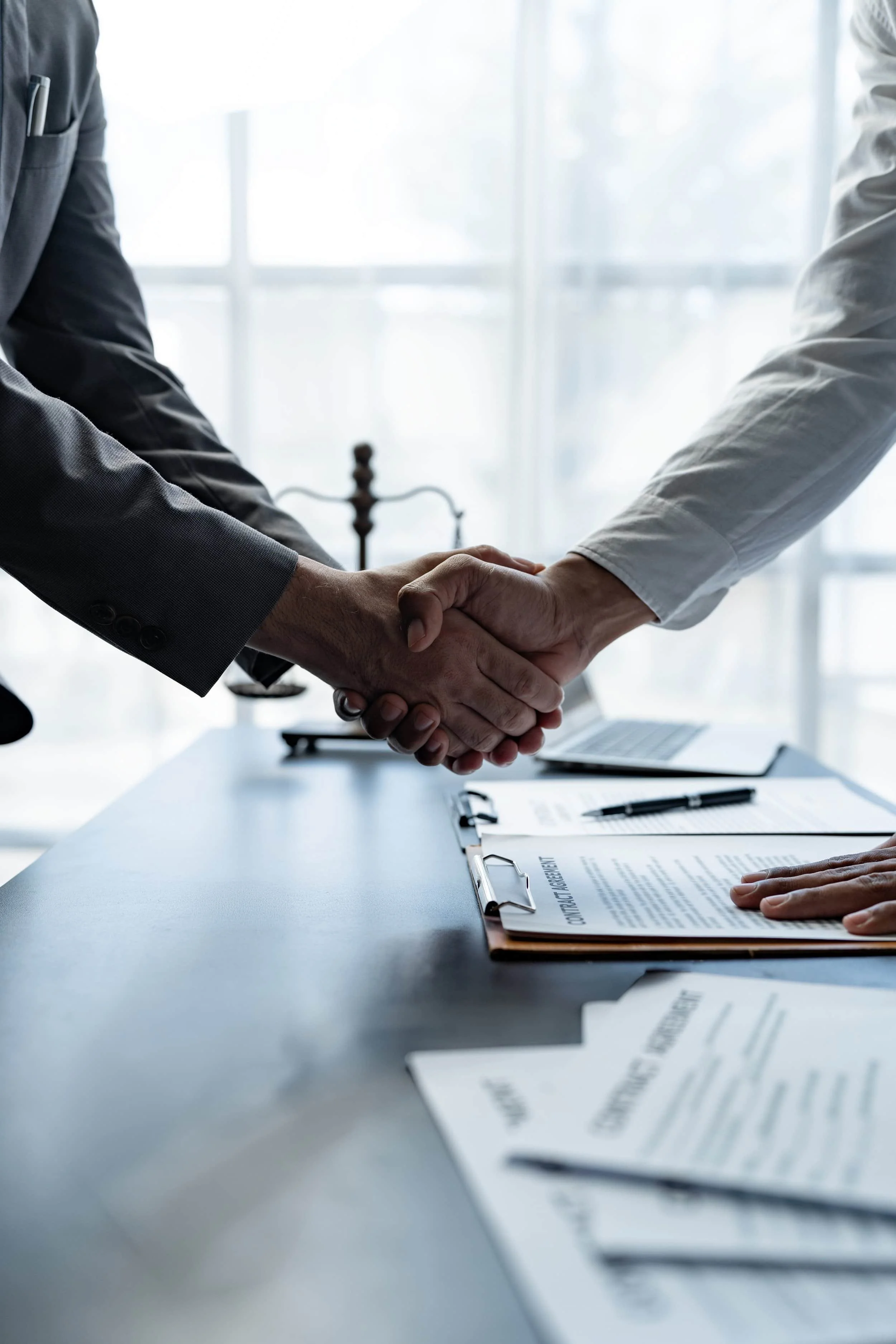 Veneziano & Lighthall brand image of handshake